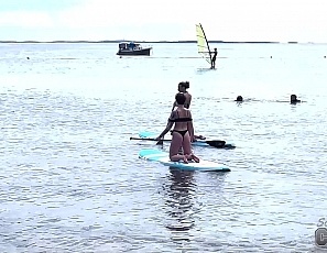 091022_hot_bikini_babes_flashing_boobs_while_standup_paddle_boarding_and_sunbathing_nude_on_the_beach