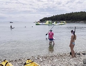 091022_hot_bikini_babes_flashing_boobs_while_standup_paddle_boarding_and_sunbathing_nude_on_the_beach